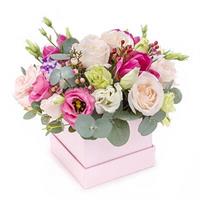 A gentle composite composition in a box with a rose, eustoma, hypericum and eucalyptus.