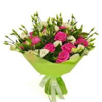 Bouquet of roses and eustomas with greens