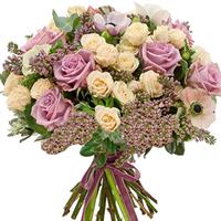A charming bouquet of roses and lilacs