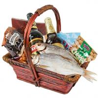 Basket with fish, crackers, nuts and beer