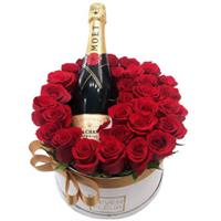 Box with roses and champagne
