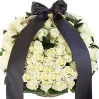 Funeral basket of white roses