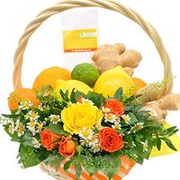 Basket with citrus fruits and flowers