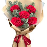 Bouquet of red roses and spruce