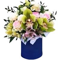 A box with orchids, roses and, eustoma and alstroemerias.
