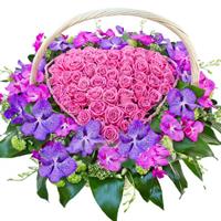 Heart of pink roses and orchids
