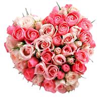 Arrangement of pink and cream roses in the form of a heart