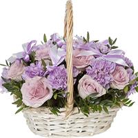Basket of lilac roses and carnations
