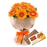 Bouquet of 7 multicolored gerberas, Milk chocolate Roshen as a gift.